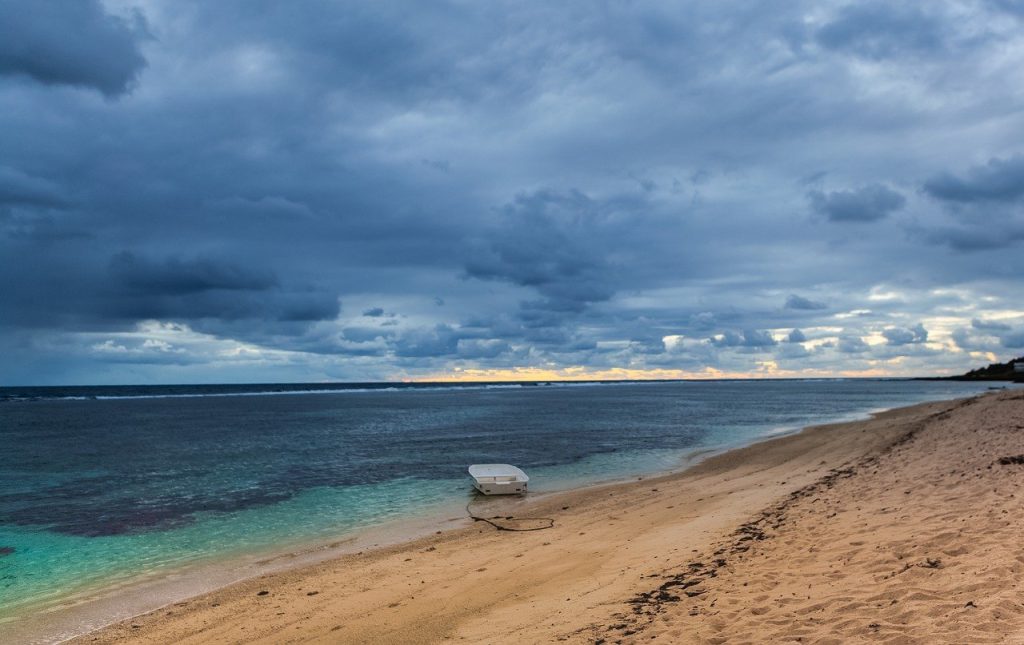 boat on sea, abandoned boat, mauritius